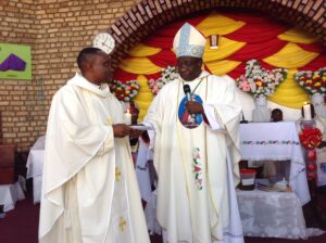 BISHOP KIBIRA AND FR ANYASIO DURING MASS AT THE CATHEDRAL