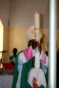 Bishop Musikuwa after lighting the candle