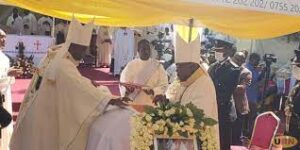 ARCHBISHOP LEMBART AND BISHOP RUBARAMIRA DURING THE BURIAL