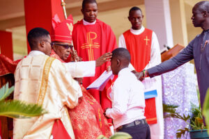 His Eminence John Cardinal Njue Anoints One of the 90 Confirmands of the Sacrament of Confirmation at the Family Day Celebrations, Sunday Jully 2, 2023