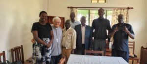 Rt Rev Guiseppe Franzelli flanked by some coordinators of Social communications under Gulu Ecclesiastical Province at Comboni Animation center in Gulu city on 5th July 2023
