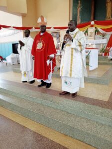 Rt Rev Sanctus Lino Wanok Bishop of Lira diocese flanked by newly Ordained Deacons Haron Ojok and Moses Opio respectively