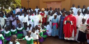 Rt Rev Sanctus Lino Wanok, Bishop of Lira diocese in group photo with some Christians after Holy Mass in Orum parish recently.