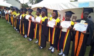 Students of Asili Vocational School in Lira city, in group photo after graduation upon completion of their course supported by ARU