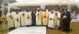 BISHOP KIBIRA, THE CLERGY, hON. KABYANGA AND OTHER POLITICAL LEADERS PAUSING FOR A PHOTO AFTER MASS AT NYAKAHYA