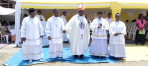 BISHOP KIBIRA WITH THE NEW EUCHARISTIC MINISTER AT KISANGA RCC