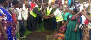 FR SUNDAY AND FR COSMAS WITH OTHER STAKEHOLDERS PLANTING AT TREE AT KYALHUMBA PARISH AFTER THE MEETING