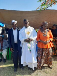 Rev. Fr. John Mangwele with his parents before the coronation