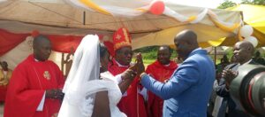 BISHOP KIBIRA WITH A COUPLE