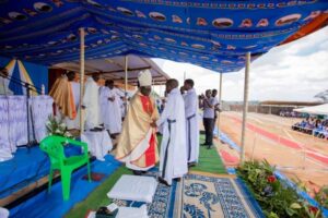 Bishop Nyirenda shake hands with Br.Cornelius Banda