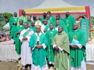 ARCHBISHOP LAMBERT WITH THE PARISH YOUTH CHAPLAIN IN THE DIOCESE OF KASESE