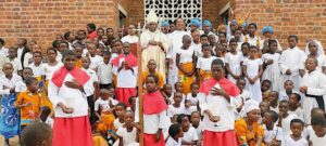 Bishop Chaima having a group photo with children on Epiphany day in Zomba diocese