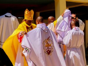 New priests being dressed in Chasuble
