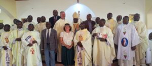 Bishop Kibira, Minister Baryomunsi and Clergy