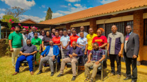 A group photo taken after the evaluation meeting