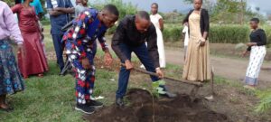 Fr. Anyasio Planting a Tree