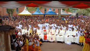 BISHOP KIBIRA WITH THE CLERGY AND MISSIONARY CHILDHOOD SHORTLY AFTER MASS (1)