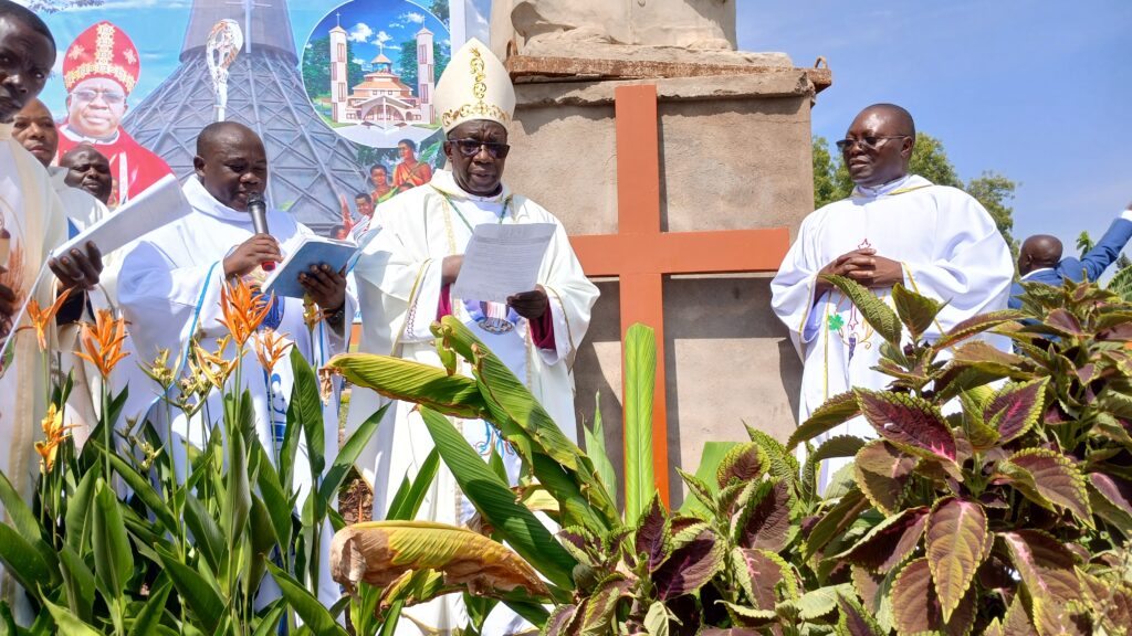 BISHOP KIBIRA, FR PETER MASEREKA THE DIOCESE PASTORAL COORDINATOR ON THE LEFT AND FR JOHN BAPTIST THE CHAIRPERSON CENTRAL COMMITTEE ON THE RIGHT
