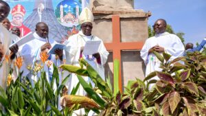 BISHOP KIBIRA, FR PETER MASEREKA THE DIOCESE PASTORAL COORDINATOR ON THE LEFT AND FR JOHN BAPTIST THE CHAIRPERSON CENTRAL COMMITTEE ON THE RIGHT