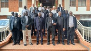 Members of Uganda Episcopal Conference pose for a photo with the chairman and Secretary General of of AMECEA and the