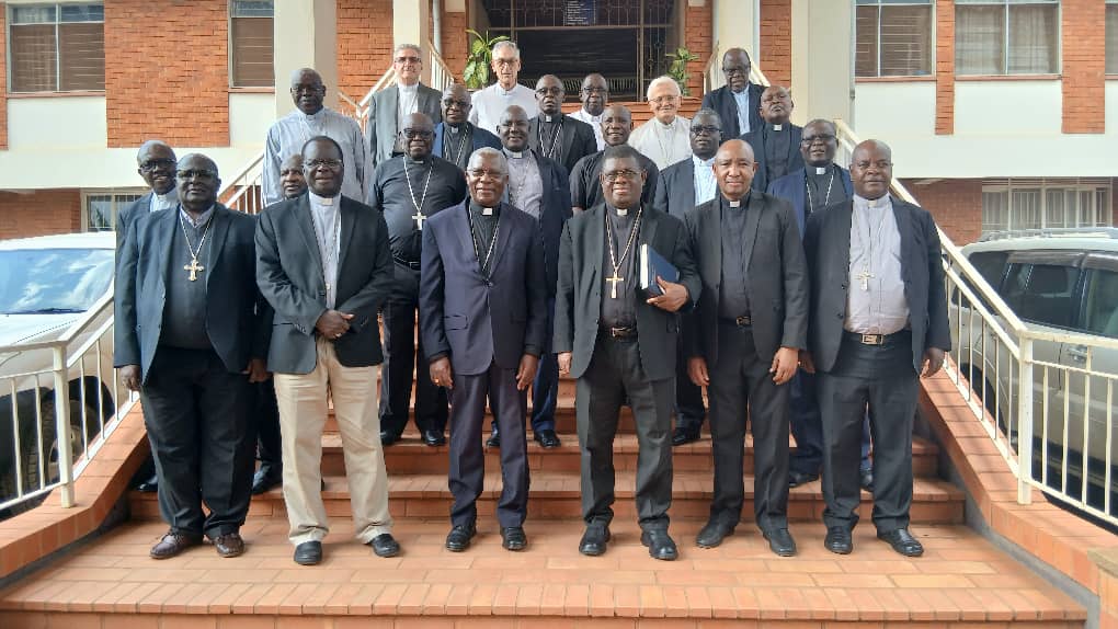 Members of Uganda Episcopal Conference pose for a photo with the chairman and Secretary General of of AMECEA and the