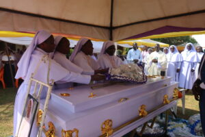 Religious Sisters Laying the Wreath on Casket of late Sr Mary Driciru