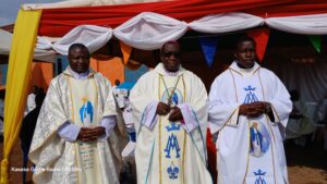 Bishop Kibira with Fr Basaliza And Fr Isongima at Kabatunda RCC
