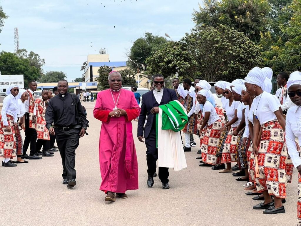 ARCHBISHOP WITH STUDENTS