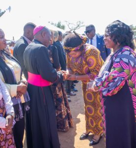 Bishop Mwakhwawa exchanging greetings with Malawi's Minister of Gender Mary Navicha during the event