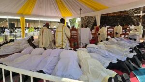 ARCHBISHOP LAMBERT DURING THE RECITATION OF THE LITANIA