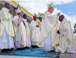 ARCHBISHOP TOMASZ LAYING HIS HAND ON THE NEW BISHOP (1)