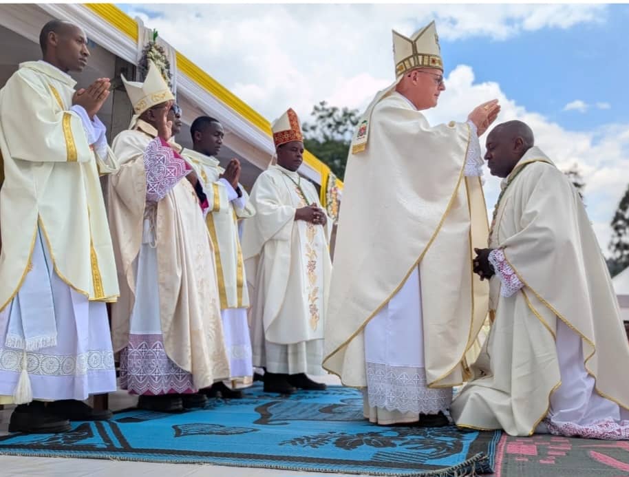 ARCHBISHOP TOMASZ LAYING HIS HAND ON THE NEW BISHOP (1)