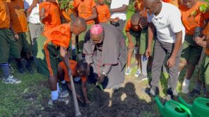 BISHOP KBIRA PLANTING A TREE DURING THE LAUNCH