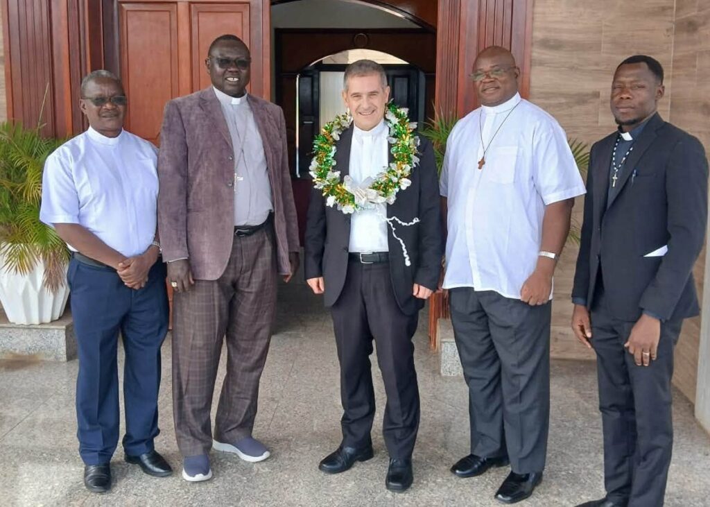 Group Photo of Monsignor Marco Ganci, Bishop Santo Loku Pio and the priests who received him